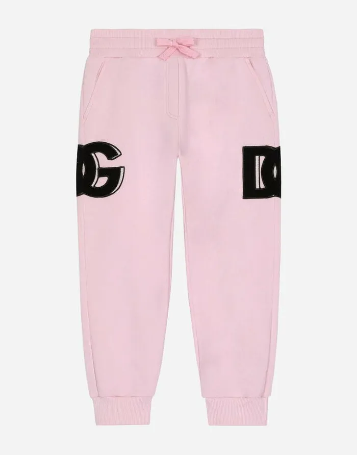 Dolce and Gabbana Trousers And Skirts Children Jersey Jogging Pants With DG Logo Patch Pink Dolce and Gabbana Trousers And Skirts Children Jersey Jogging Pants With DG Logo Patch Pink