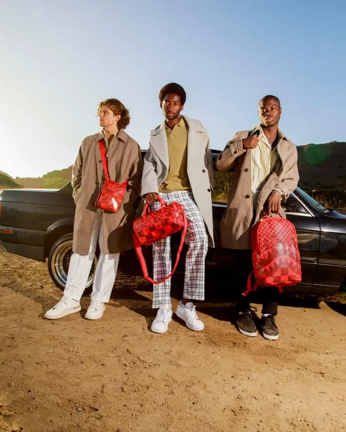 SPRAYGROUND XTC SHARKS IN WONDERLAND SLING Bags